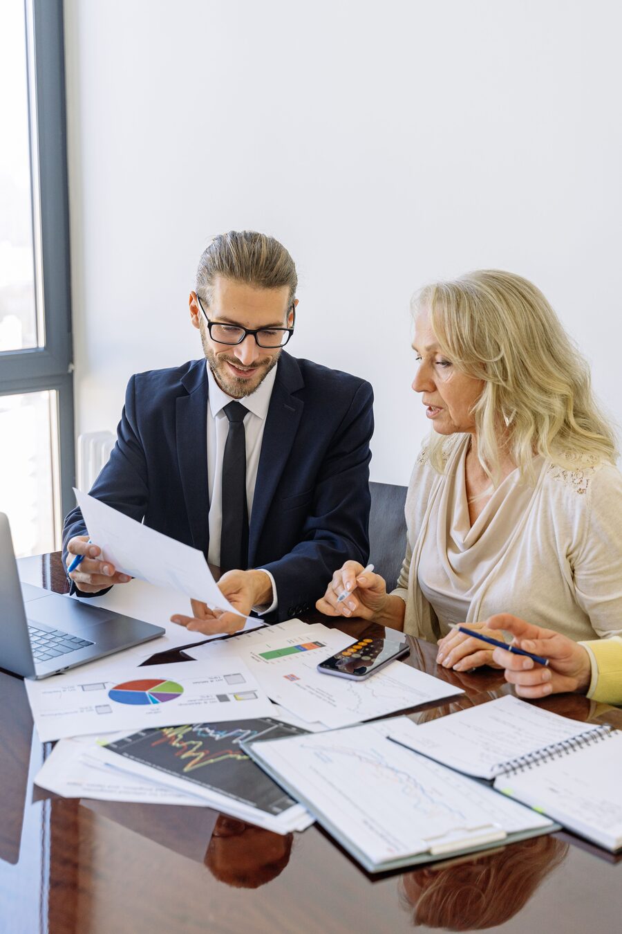 A Gusto Global adviser reviewing figures with a client
